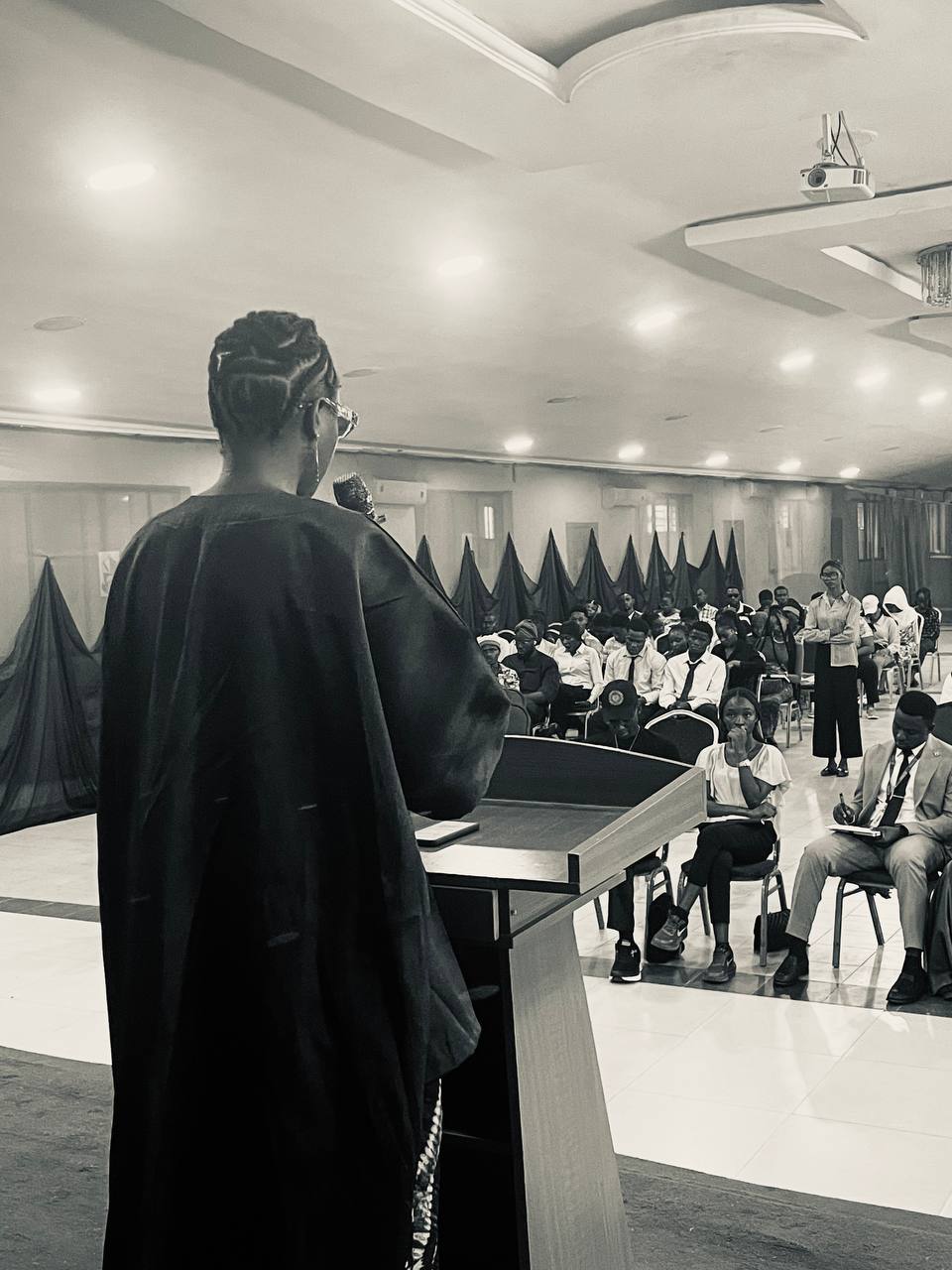 Priscilla addressing an audience at Lead City University